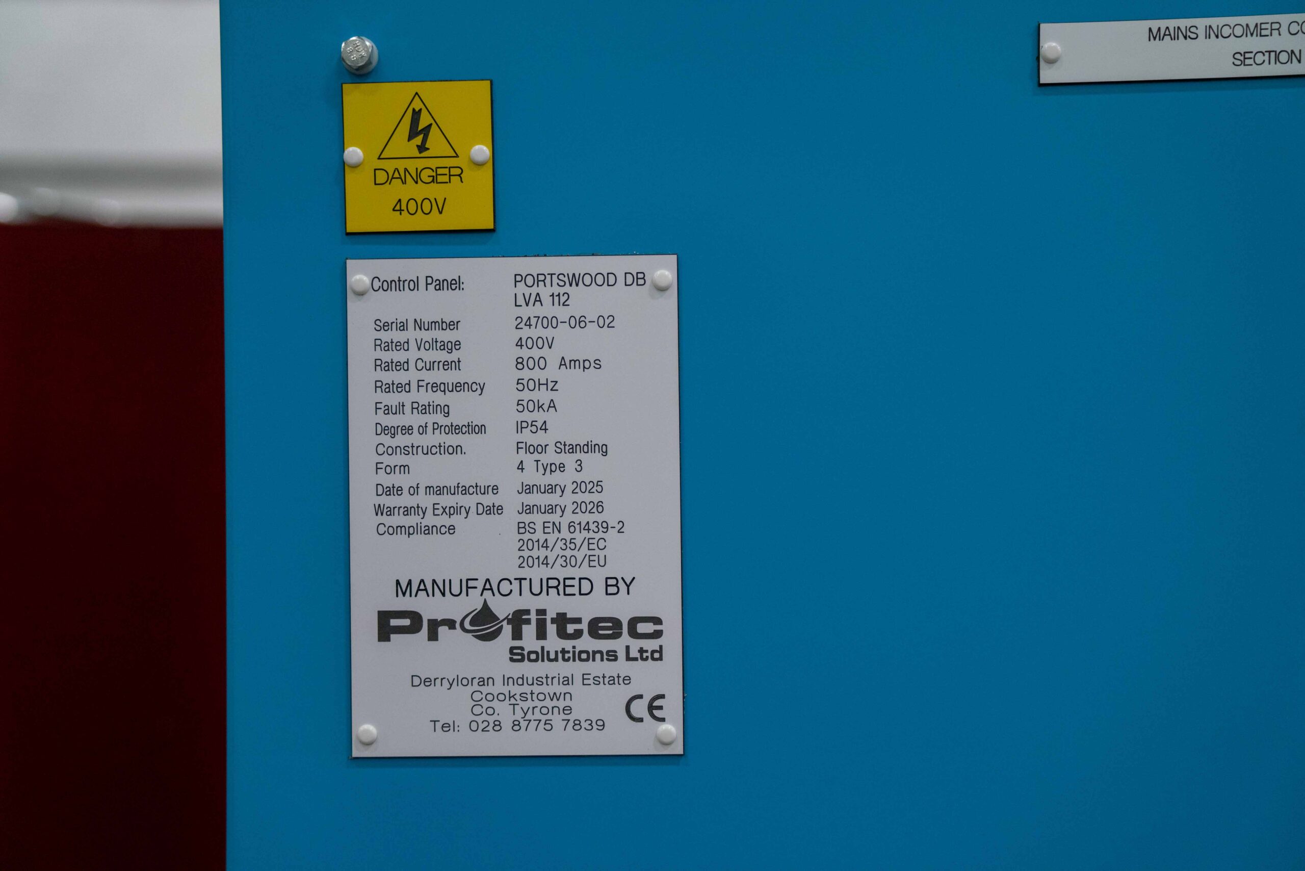Enisca Browne - A control panel label with technical details and a 