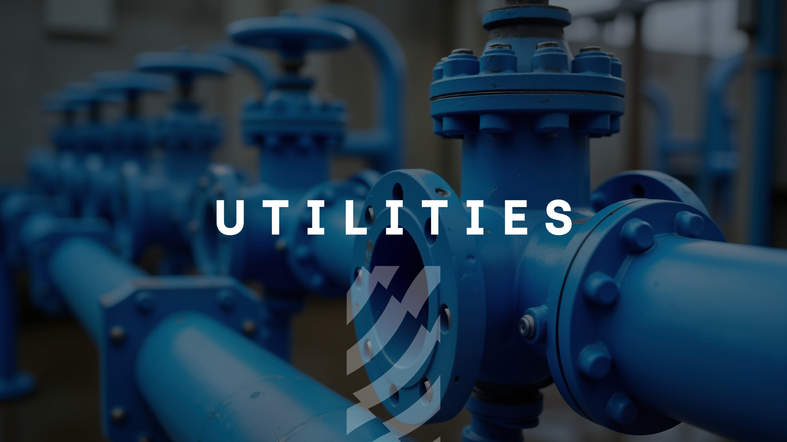 Enisca Browne - Blue industrial pipes and valves with the word 